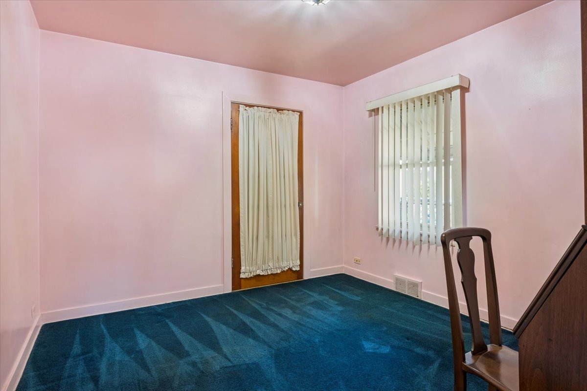 7841 44th Street Lyons, IL 60534 - Photo 11 of 23 a view of empty room with wooden floor and fan