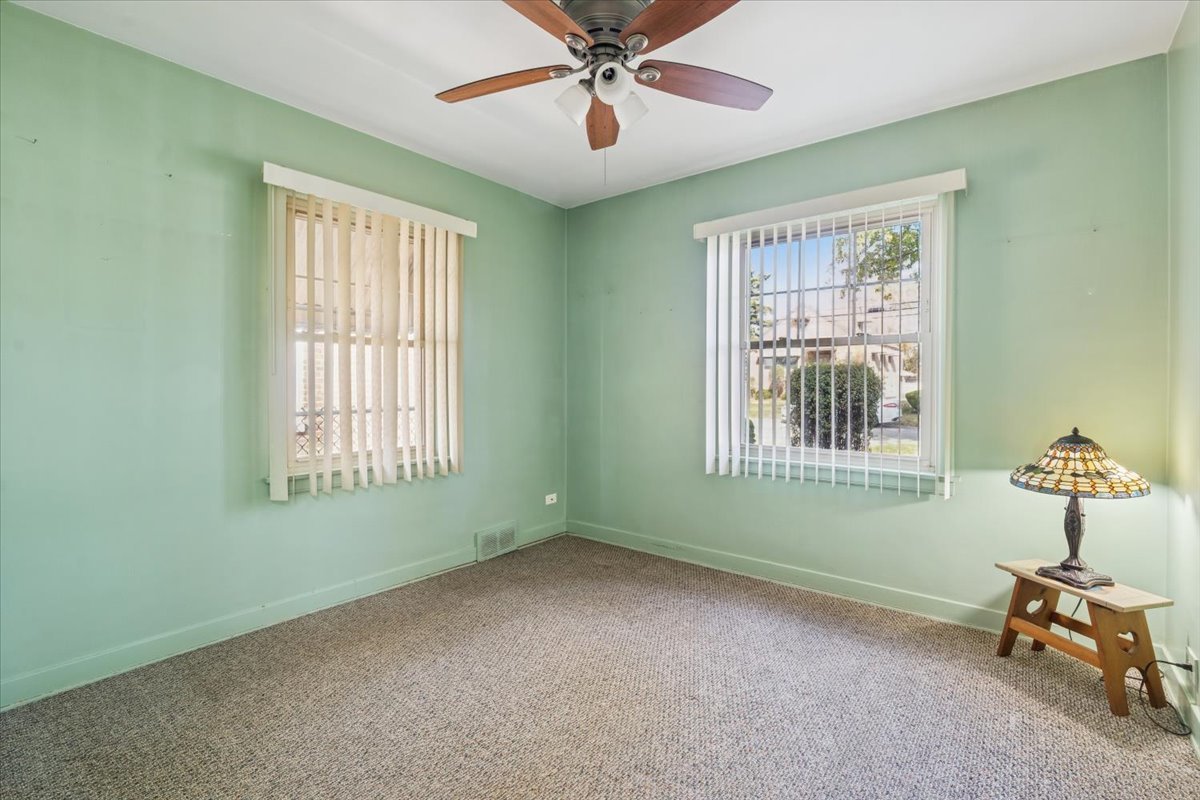 7841 44th Street Lyons, IL 60534 - Photo 9 of 23 a view of an empty room with a window
