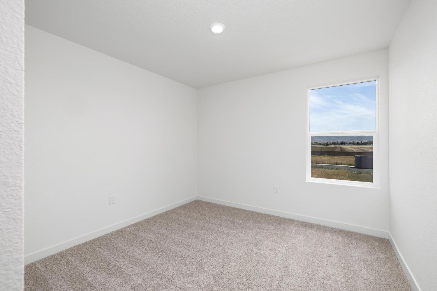 820 Chatham Lane Patterson, CA 95363 - Photo 14 of 19 an empty room with a window