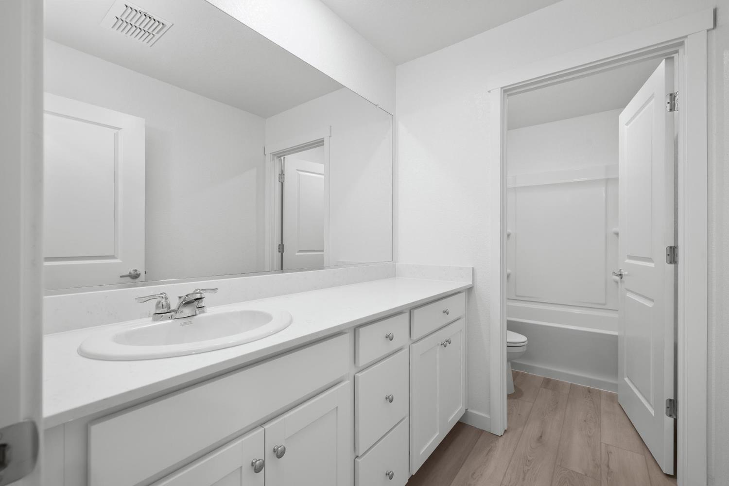 820 Chatham Lane Patterson, CA 95363 - Photo 17 of 19 a bathroom with a sink double vanity granite tub and a mirror