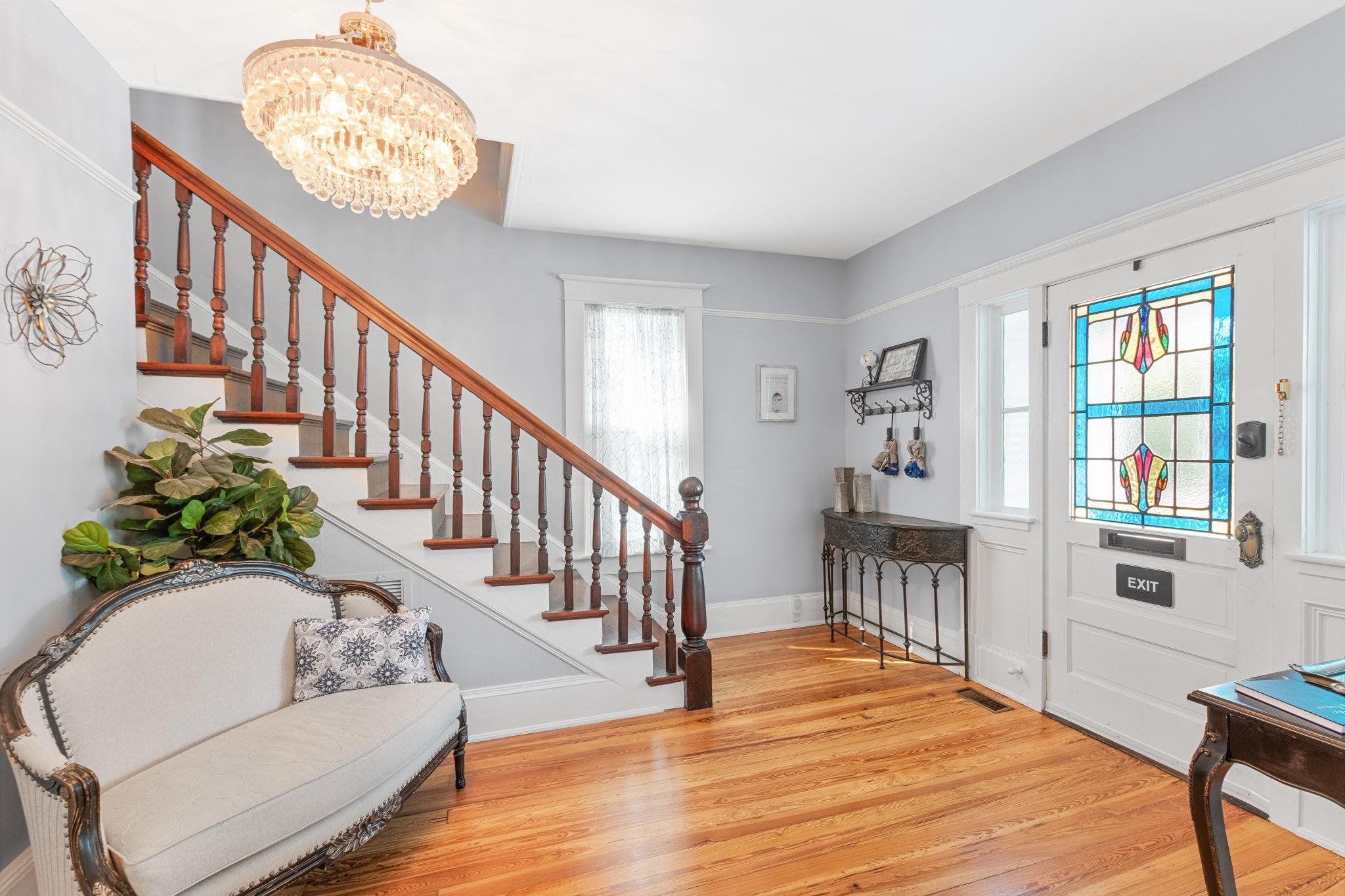 21 Saragossa Street St. Augustine, FL 32084 - Photo 11 of 66 Foyer with light wood-style flooring and suspended lighting