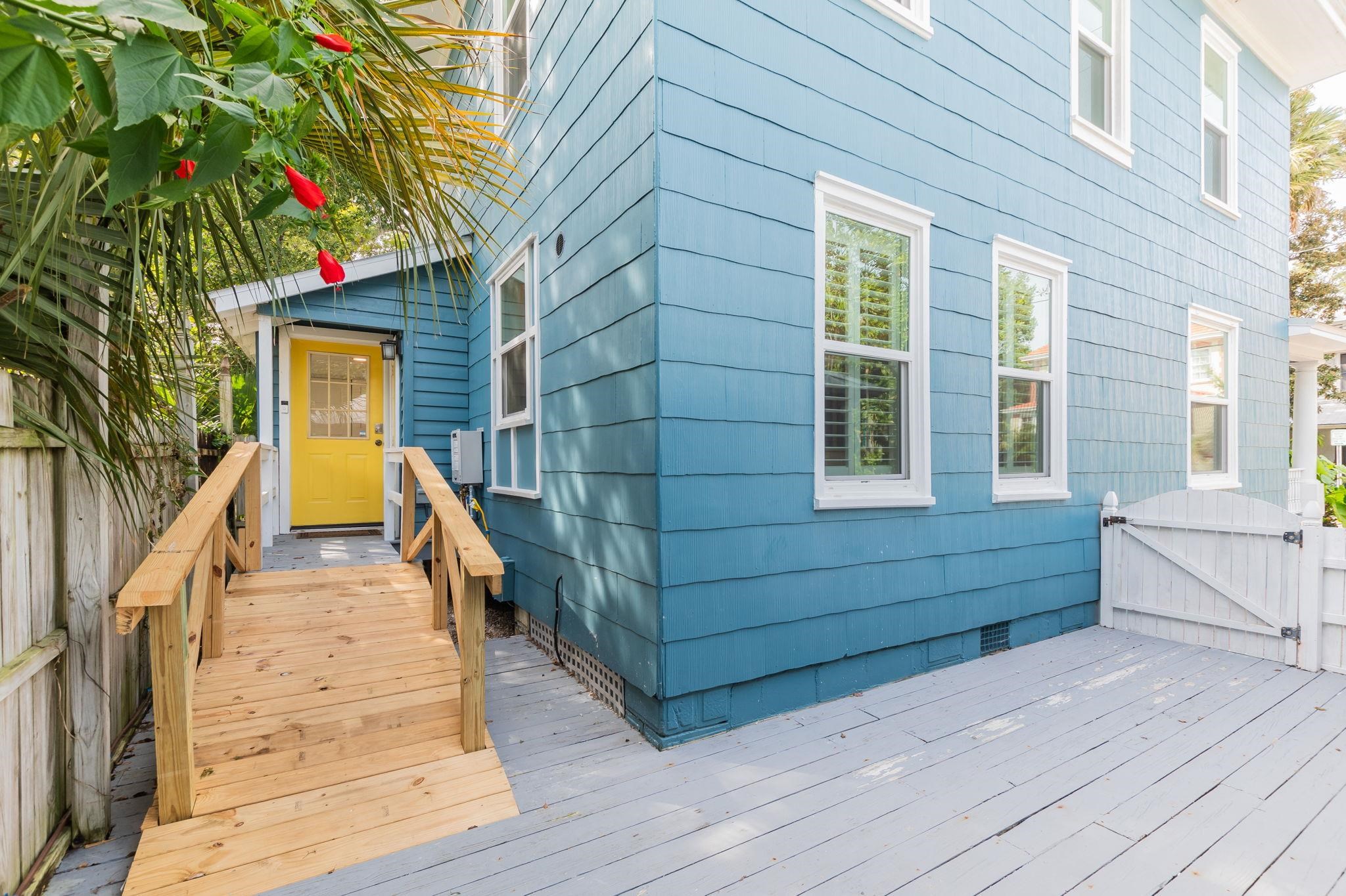 21 Saragossa Street St. Augustine, FL 32084 - Photo 13 of 66 Wooden terrace with a gate