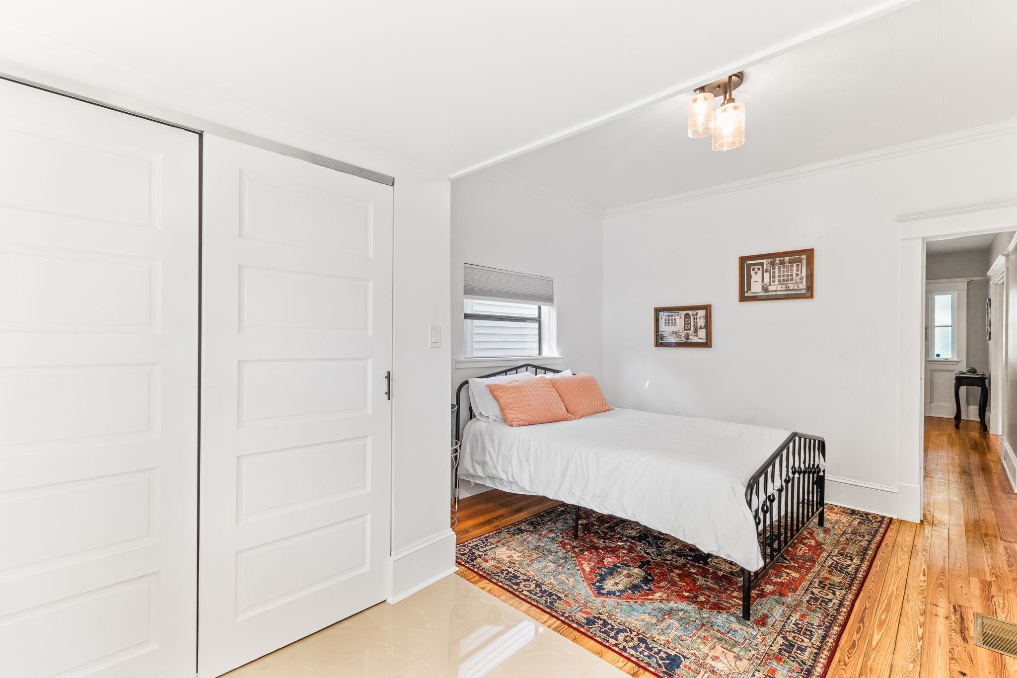 21 Saragossa Street St. Augustine, FL 32084 - Photo 28 of 66 Bedroom featuring crown molding, light wood-style floors, and a closet