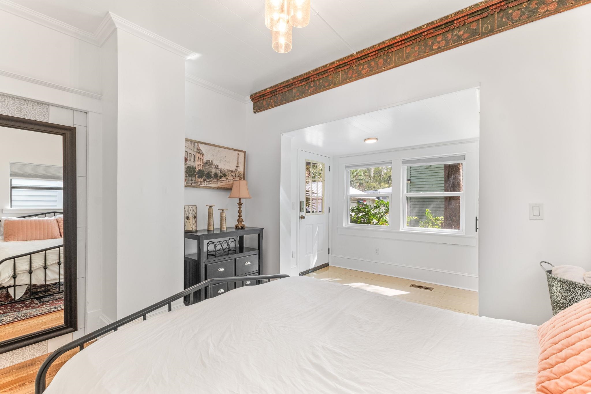 21 Saragossa Street St. Augustine, FL 32084 - Photo 30 of 66 Bedroom with ornamental molding and suspended lighting