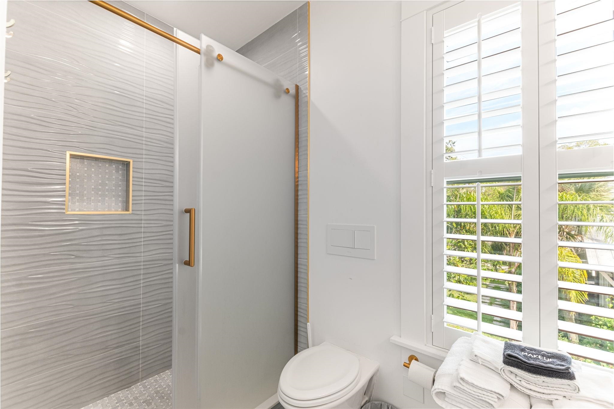 21 Saragossa Street St. Augustine, FL 32084 - Photo 42 of 66 Bathroom featuring healthy amount of natural light and a shower stall
