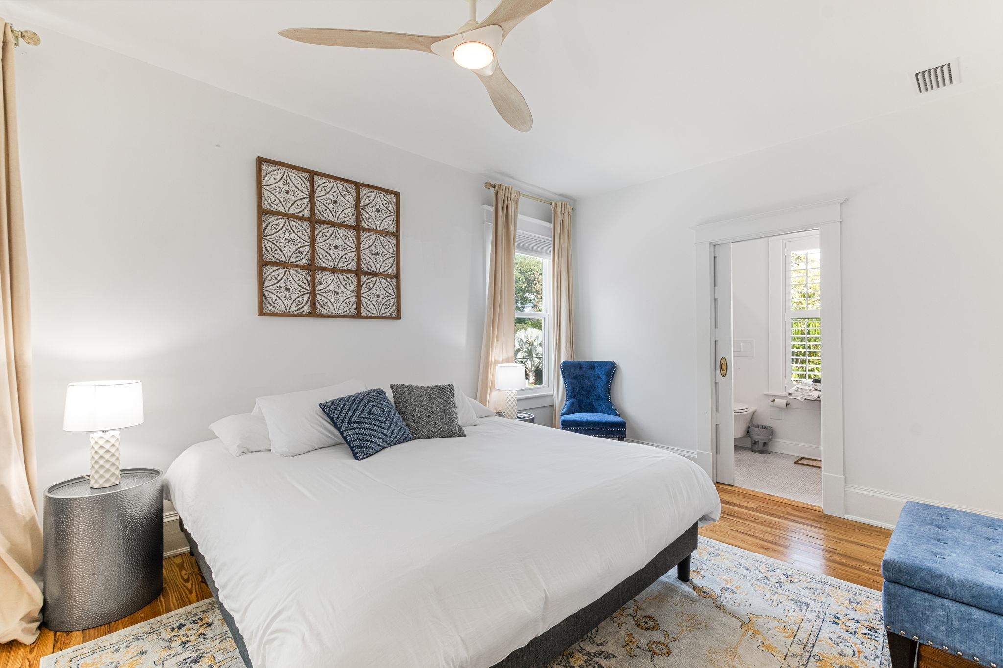 21 Saragossa Street St. Augustine, FL 32084 - Photo 46 of 66 Bedroom with light wood-style flooring, ensuite bathroom, and a ceiling fan