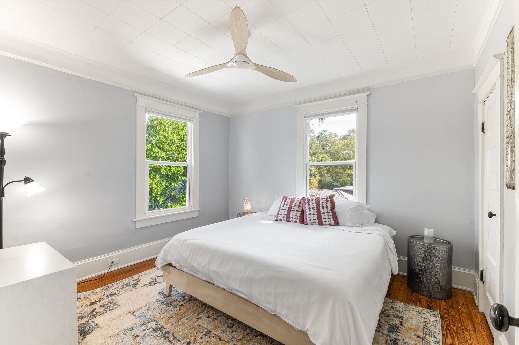 21 Saragossa Street St. Augustine, FL 32084 - Photo 9 of 66 Bedroom featuring crown molding, wood finished floors, and a ceiling fan