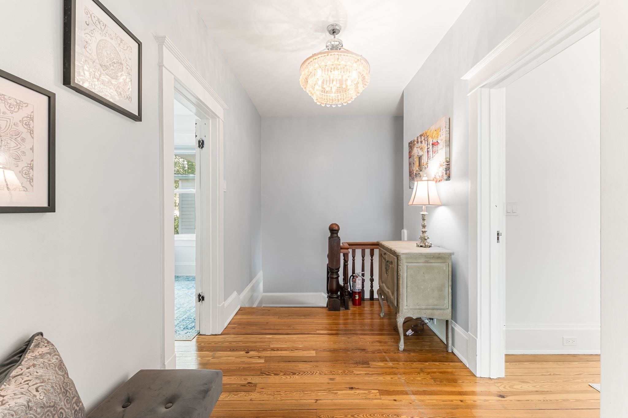 21 Saragossa Street St. Augustine, FL 32084 - Photo 10 of 66 Hall with light wood finished floors and suspended lighting