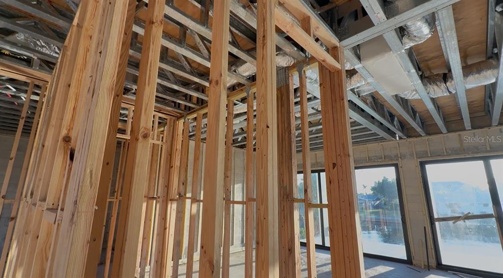 242 Bangsberg Road Southeast Port Charlotte, FL 33952 - Photo 14 of 18 a view of an entryway with wooden floor