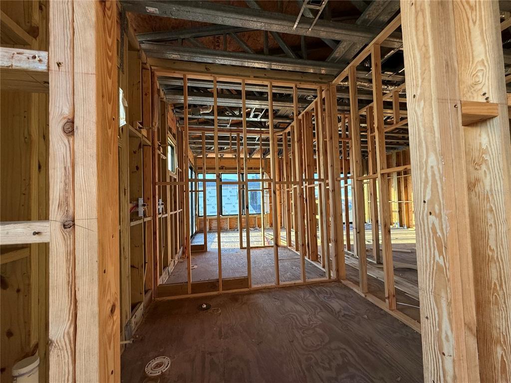 242 Bangsberg Road Southeast Port Charlotte, FL 33952 - Photo 16 of 18 a view of porch with wooden floor