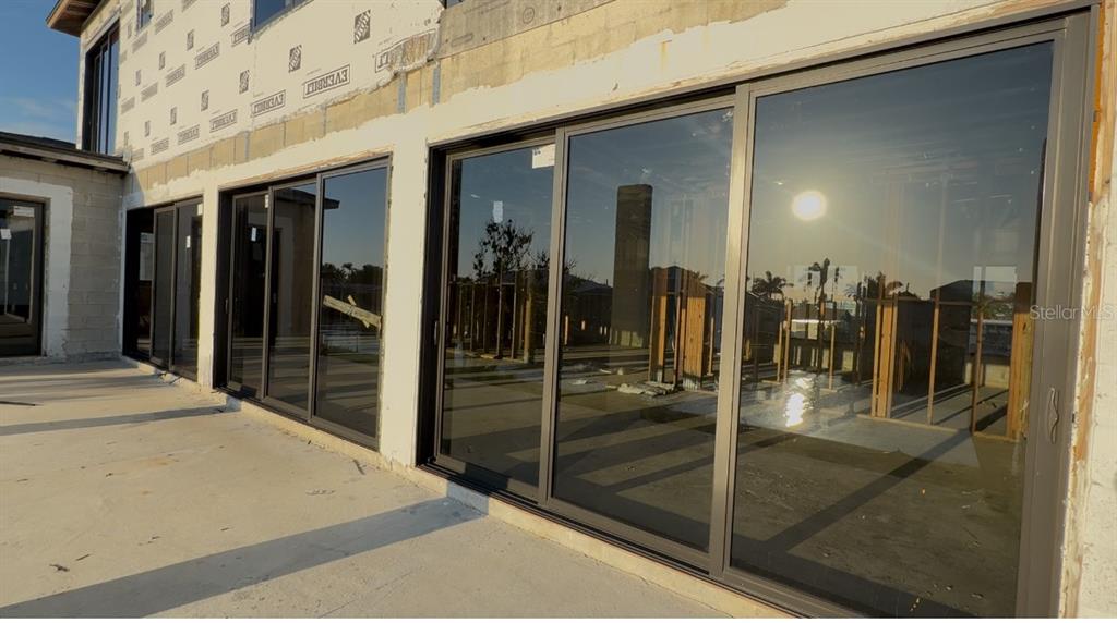 242 Bangsberg Road Southeast Port Charlotte, FL 33952 - Photo 9 of 18 a bathroom with a glass shower door