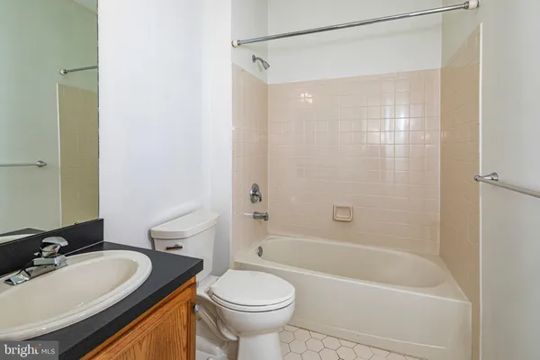 a bathroom with a sink a toilet and a bathtub