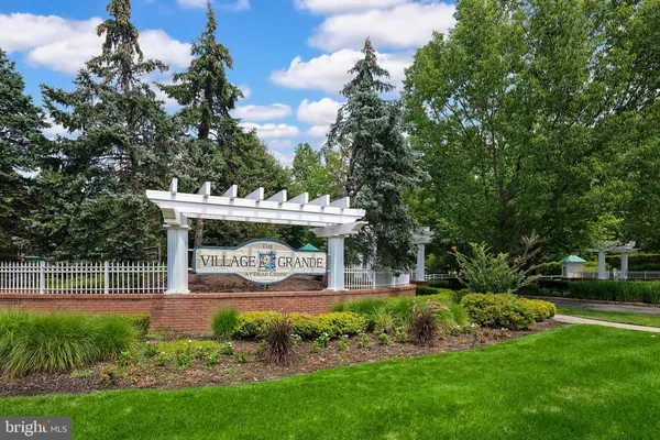 a view of a garden with lawn chairs and a big yard