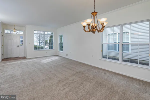 a view of livingroom with furniture wooden floor and chandelier