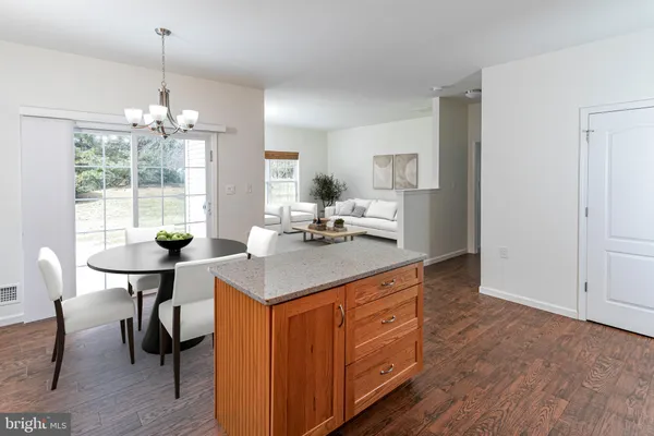 a kitchen with sink cabinets and dining table