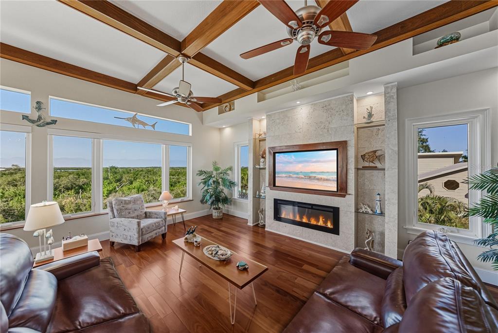 125 Burns Road Terra Ceia, FL 34250 - Photo 11 of 90 a living room with furniture fireplace and flat screen tv
