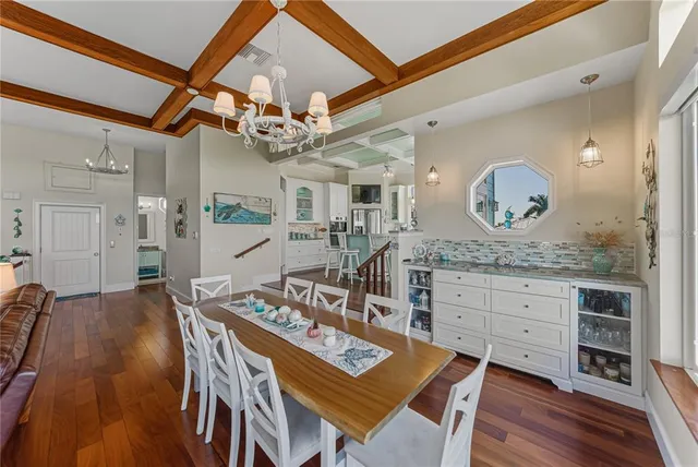 a kitchen with stainless steel appliances granite countertop a stove refrigerator and cabinets
