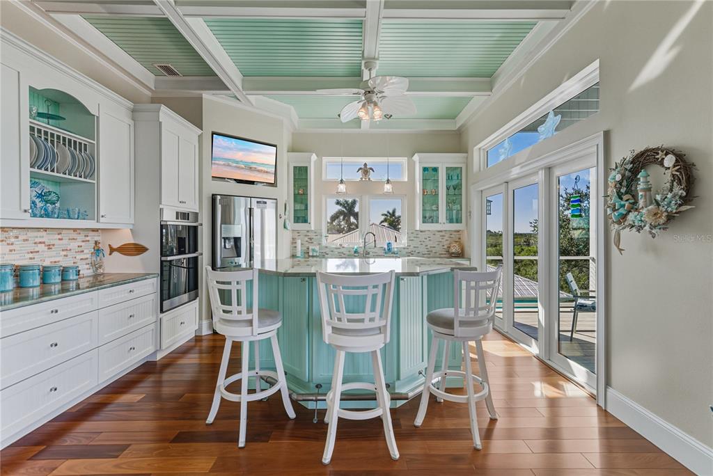 125 Burns Road Terra Ceia, FL 34250 - Photo 18 of 90 a view of a dining room with furniture window and wooden floor