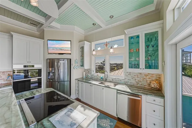 a kitchen with cabinets and window