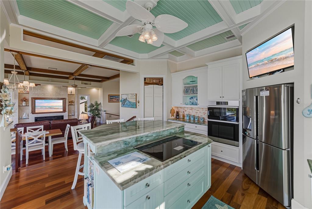 125 Burns Road Terra Ceia, FL 34250 - Photo 23 of 90 a kitchen with stainless steel appliances granite countertop a stove refrigerator and cabinets