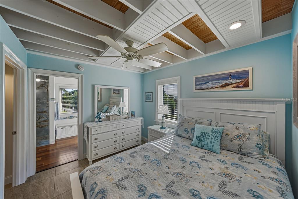125 Burns Road Terra Ceia, FL 34250 - Photo 35 of 90 a bedroom with a large bed and a large window