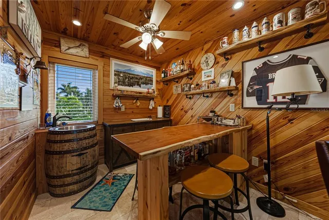 an aerial view of a house with a lake view