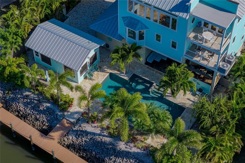 125 Burns Road Terra Ceia, FL 34250 - Photo 53 of 90 a backyard of a house with lots of green space