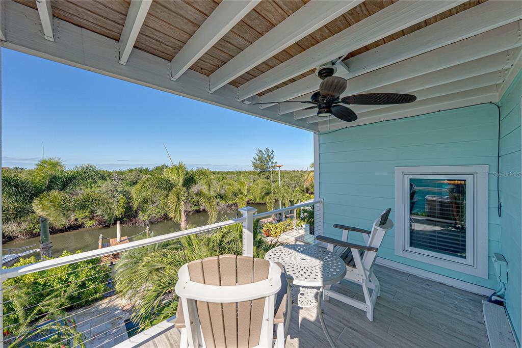 125 Burns Road Terra Ceia, FL 34250 - Photo 71 of 90 a view of a porch with furniture and wooden floor