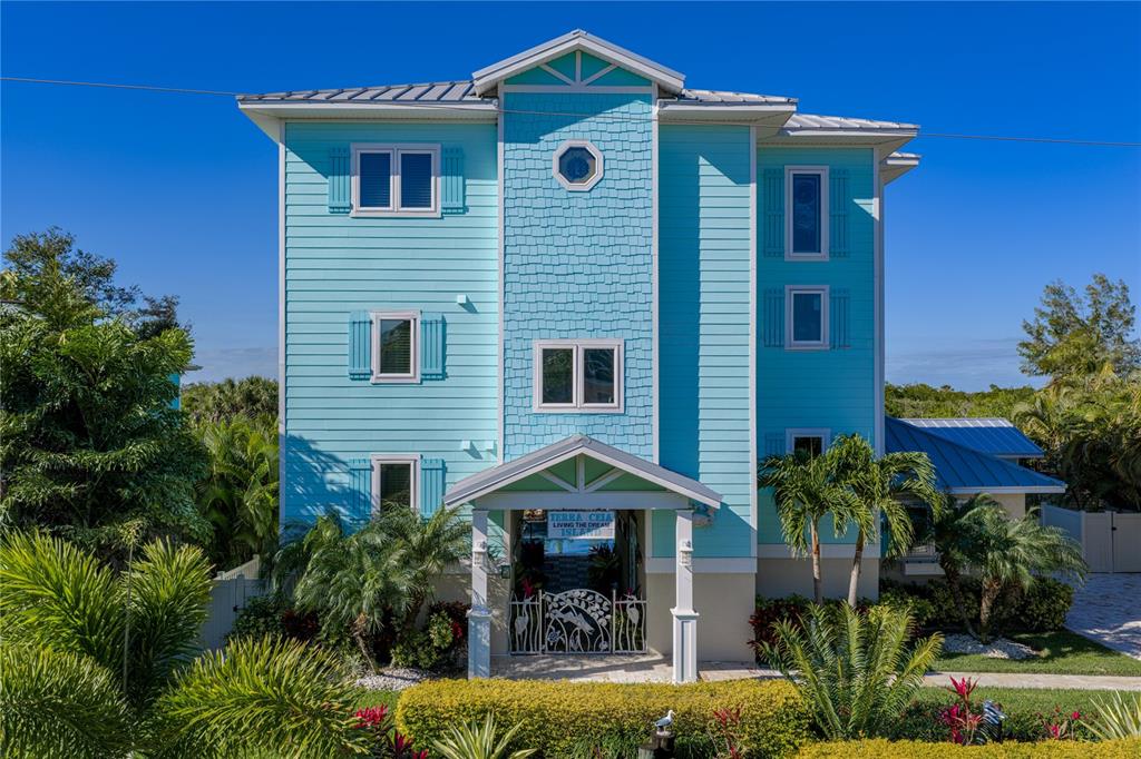 125 Burns Road Terra Ceia, FL 34250 - Photo 76 of 90 a front view of a house with garden