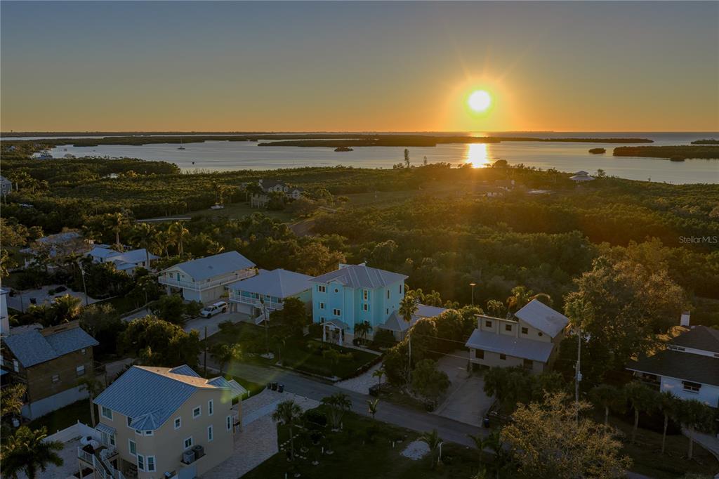 125 Burns Road Terra Ceia, FL 34250 - Photo 81 of 90 an aerial view of ocean and residential houses with outdoor space