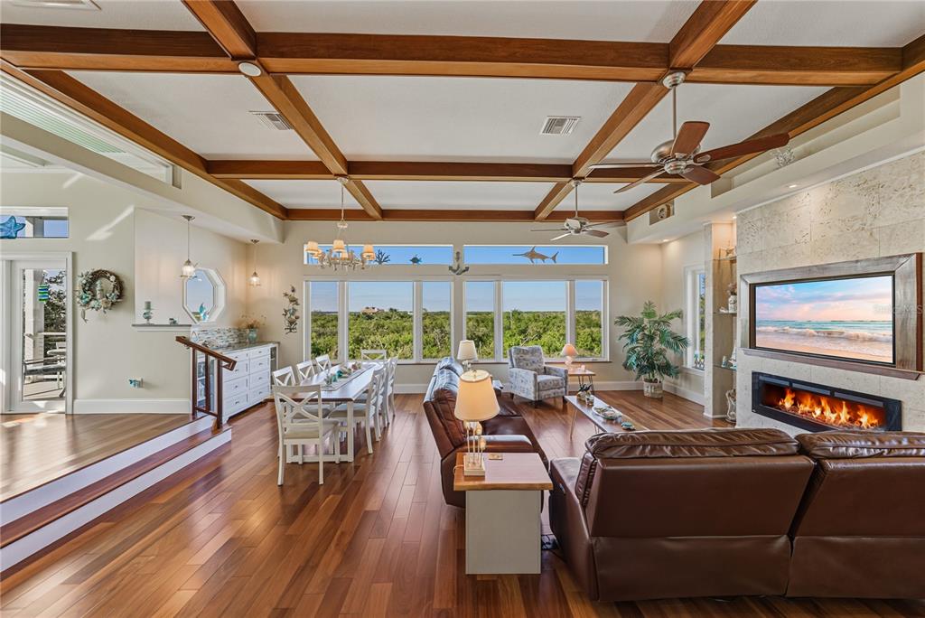 125 Burns Road Terra Ceia, FL 34250 - Photo 10 of 90 a living room with furniture a large window and wooden floor