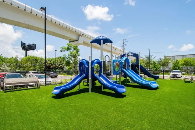 a view of a patio with a table and chairs