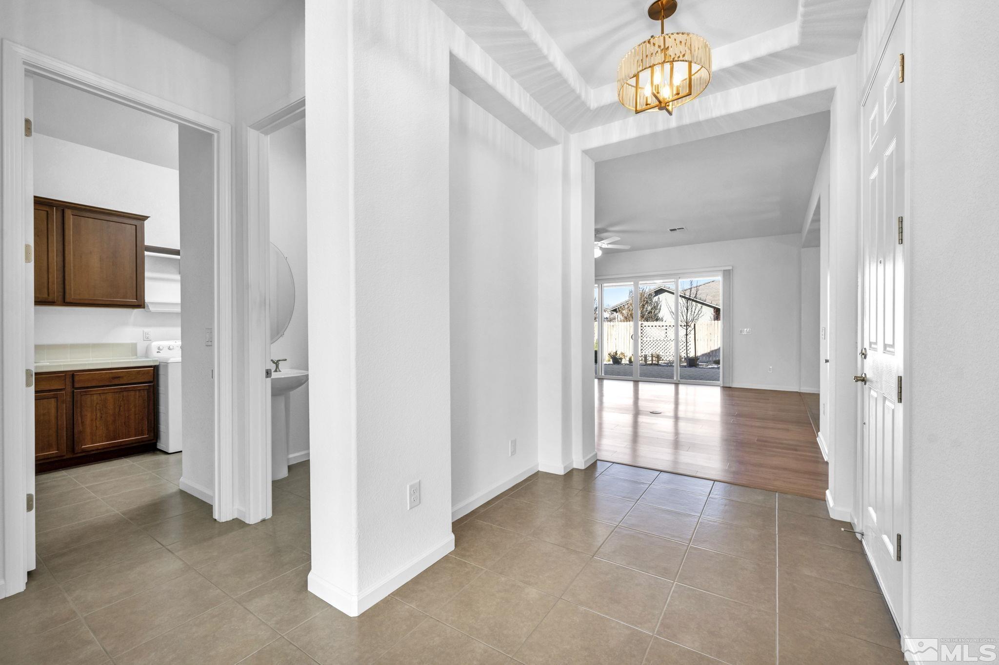 9825 Hafflinger Lane Reno, NV 89521 - Photo 24 of 39 a view of a hallway with dining area