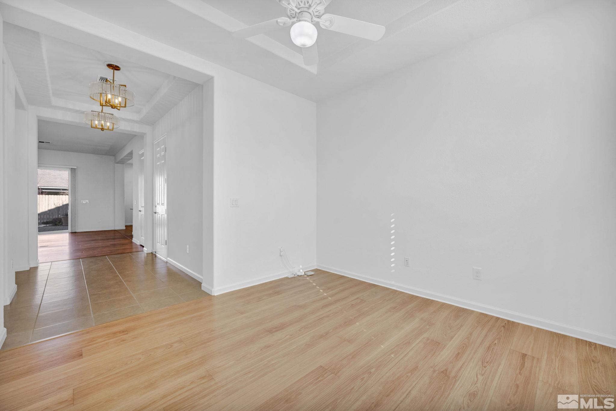 9825 Hafflinger Lane Reno, NV 89521 - Photo 25 of 39 a view of an empty room and wooden floor