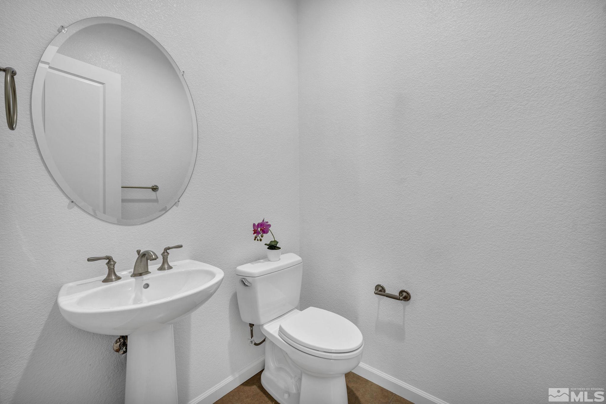 9825 Hafflinger Lane Reno, NV 89521 - Photo 26 of 39 a bathroom with a sink and a toilet