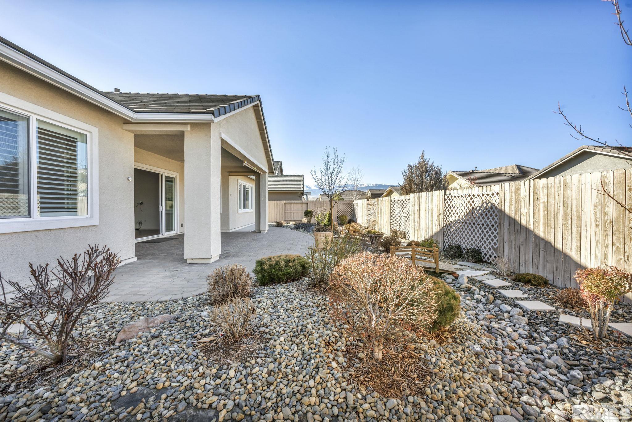 9825 Hafflinger Lane Reno, NV 89521 - Photo 29 of 39 a view of a house with a yard