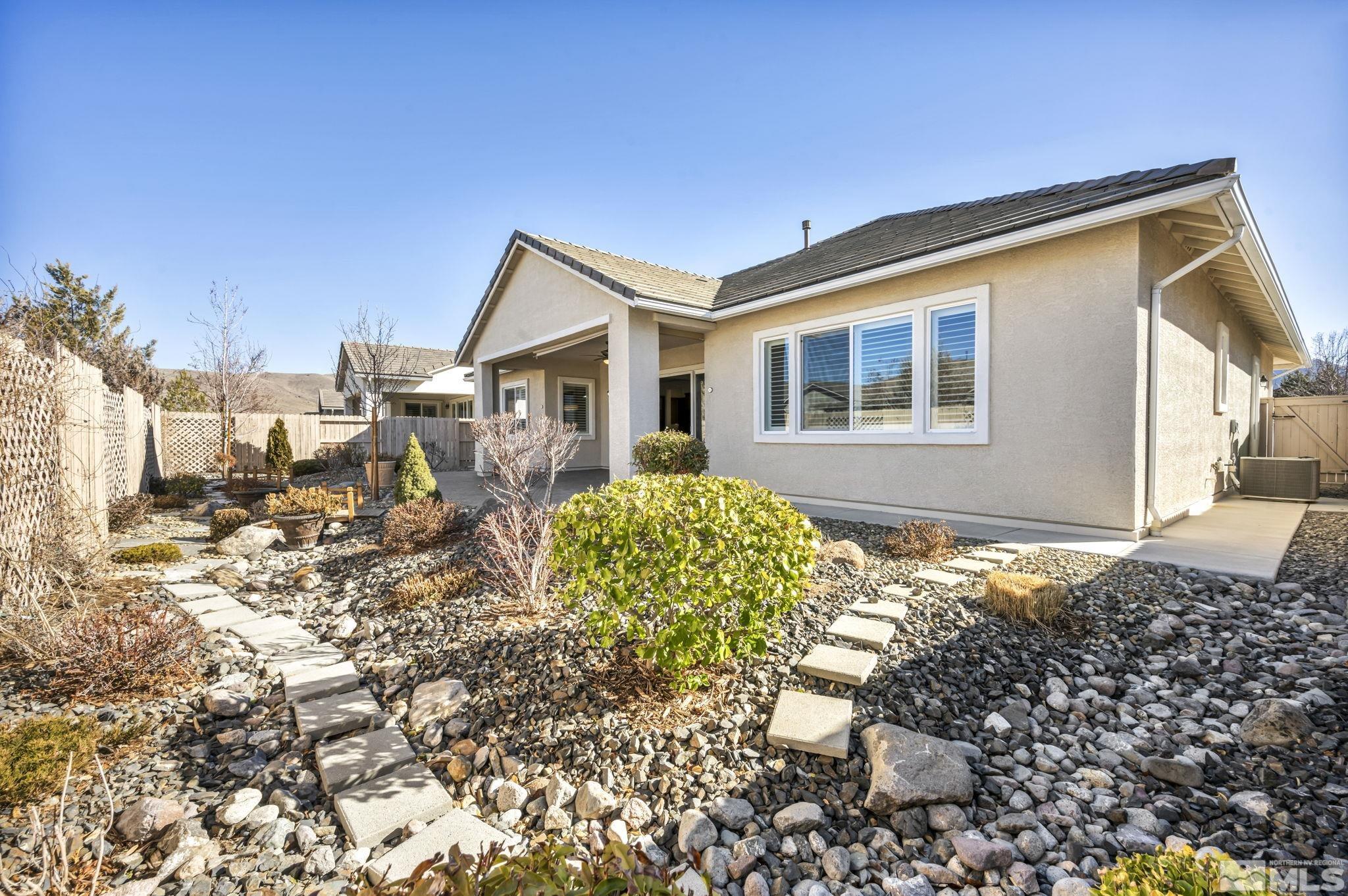 9825 Hafflinger Lane Reno, NV 89521 - Photo 31 of 39 a front view of a house with garden