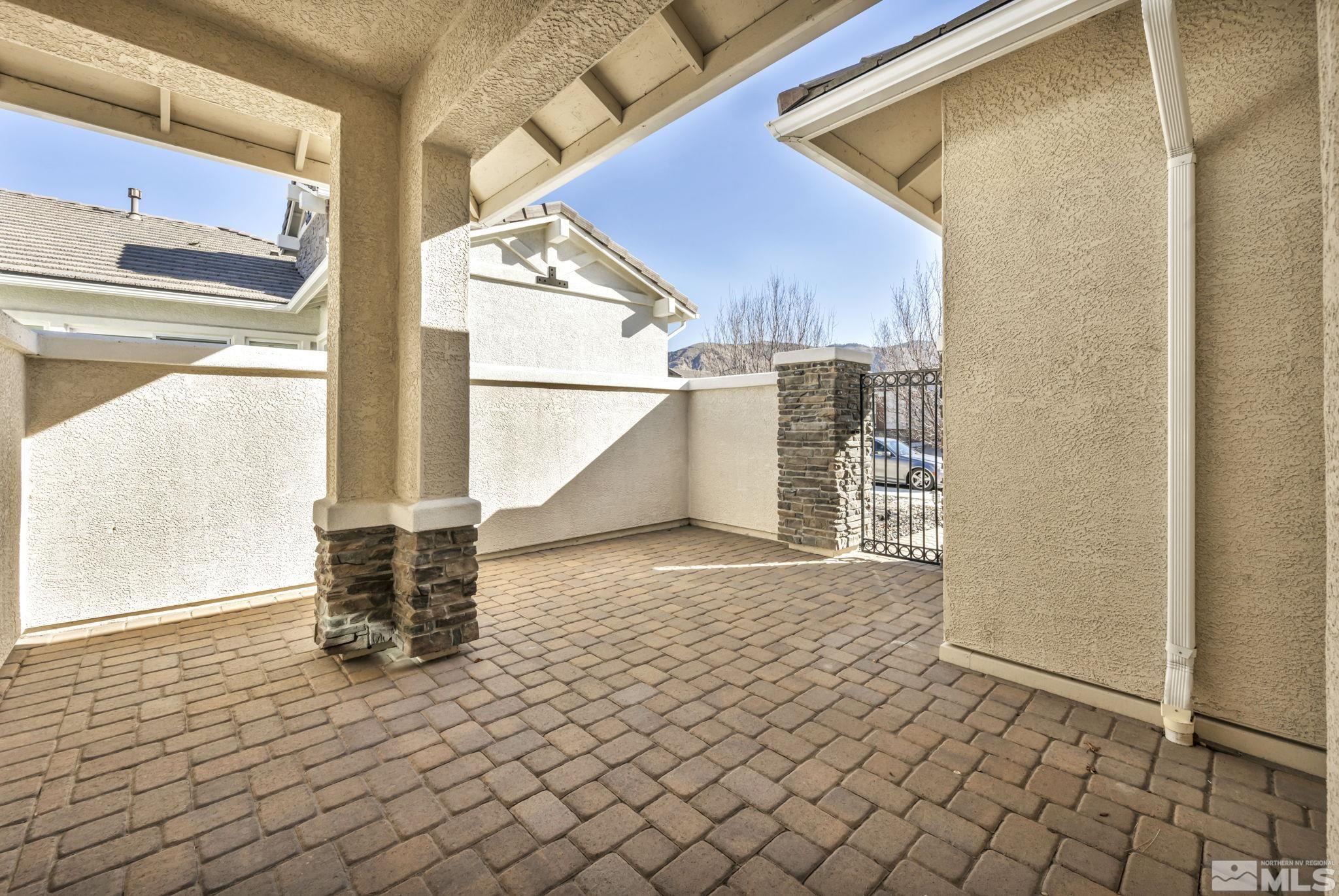 9825 Hafflinger Lane Reno, NV 89521 - Photo 32 of 39 a view of a porch with a table and chairs