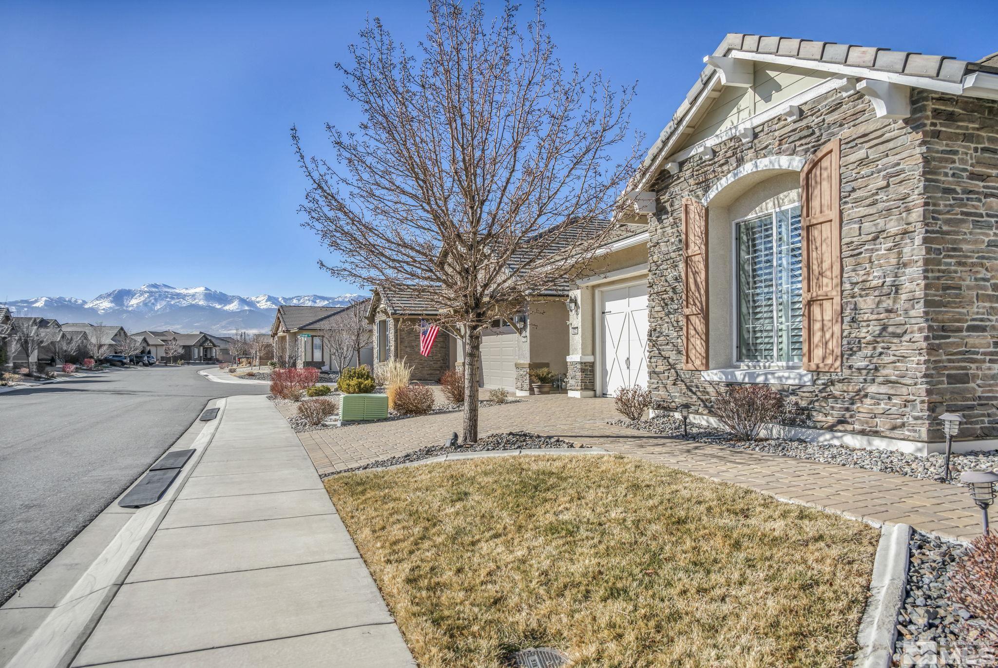 9825 Hafflinger Lane Reno, NV 89521 - Photo 34 of 39 a swimming pool with outdoor seating and yard