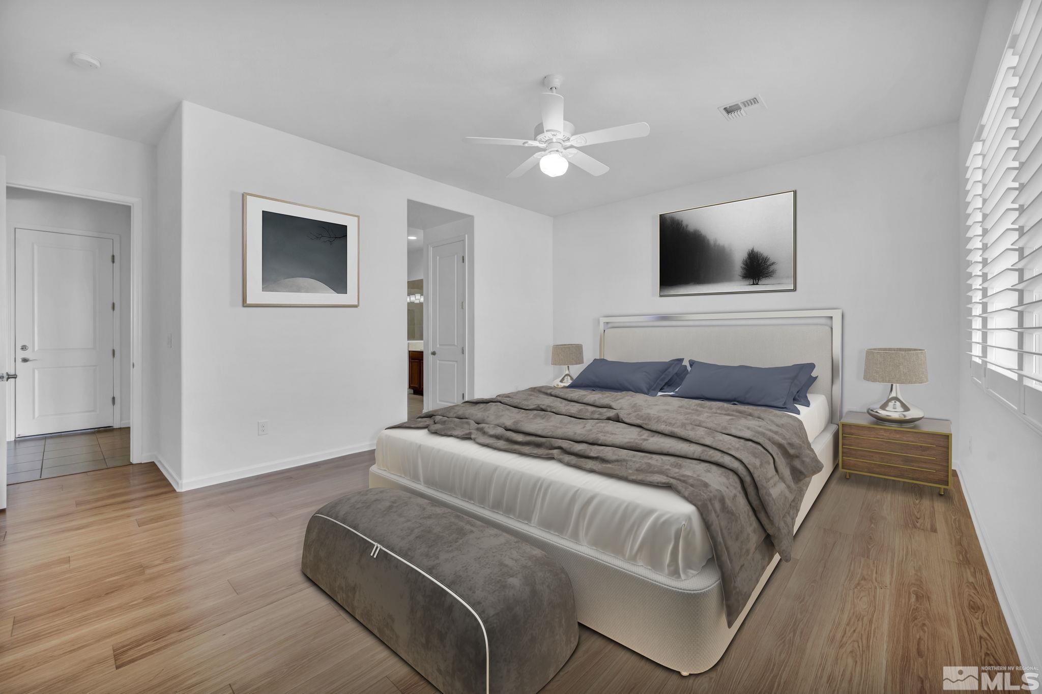 9825 Hafflinger Lane Reno, NV 89521 - Photo 5 of 39 a bedroom with a large bed and a window