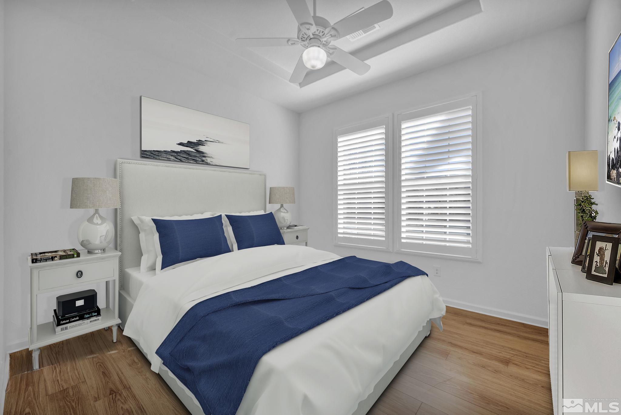 9825 Hafflinger Lane Reno, NV 89521 - Photo 6 of 39 a bedroom with bed and a chandelier