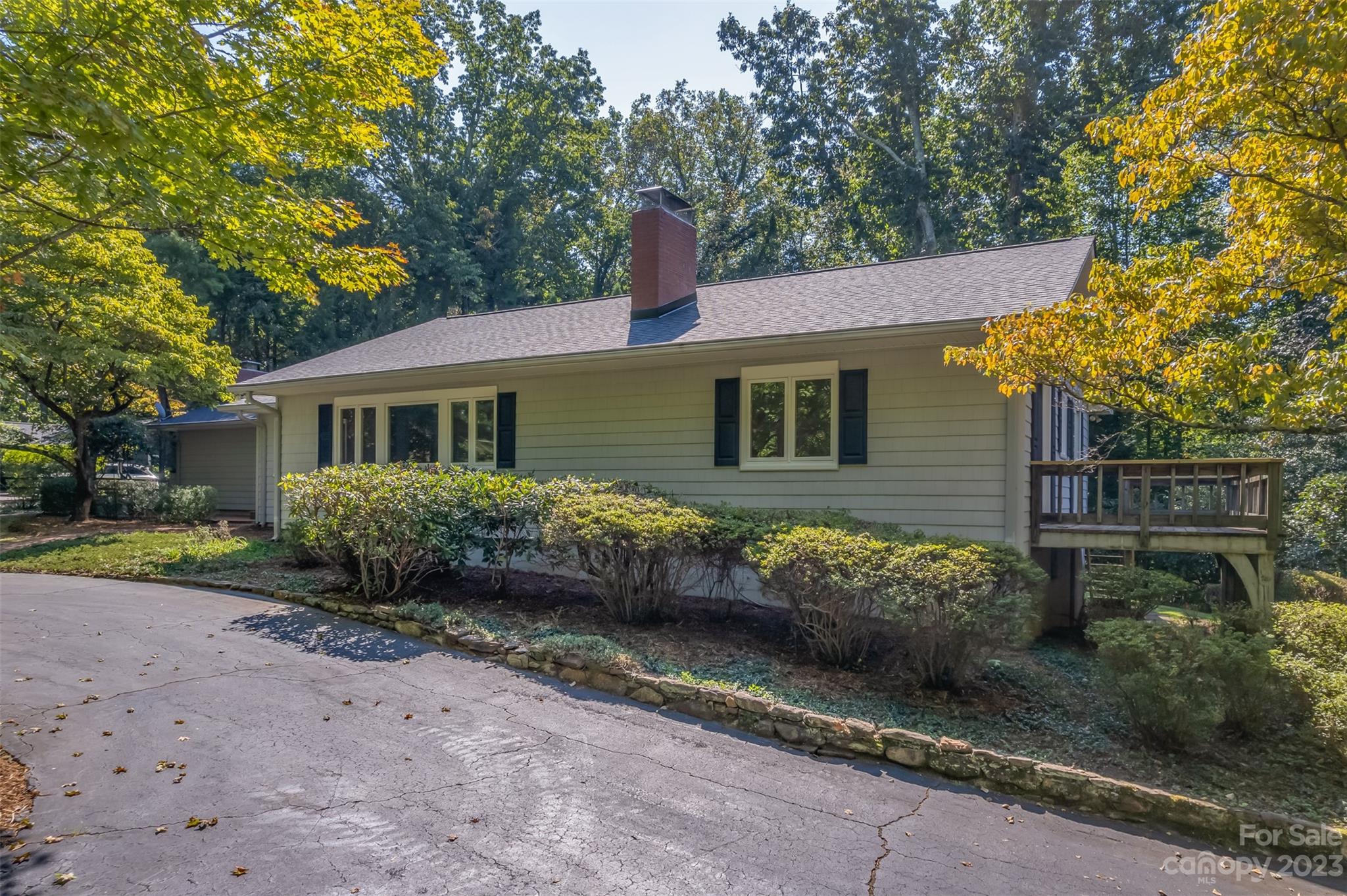 269 Golden Road Tryon, NC 28782 - Photo 3 of 43 a front view of a house with garden
