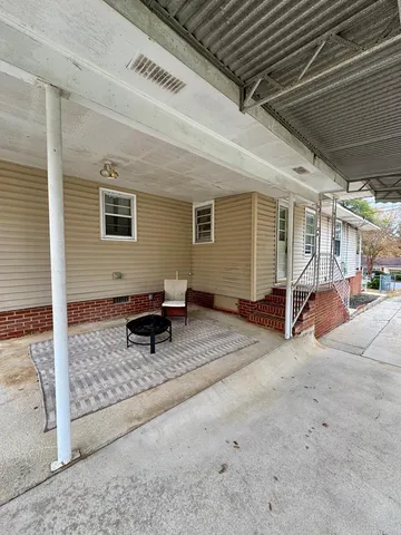 a view of livingroom with furniture and garden