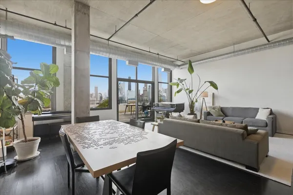 a view of a dining room with furniture window and wooden floor