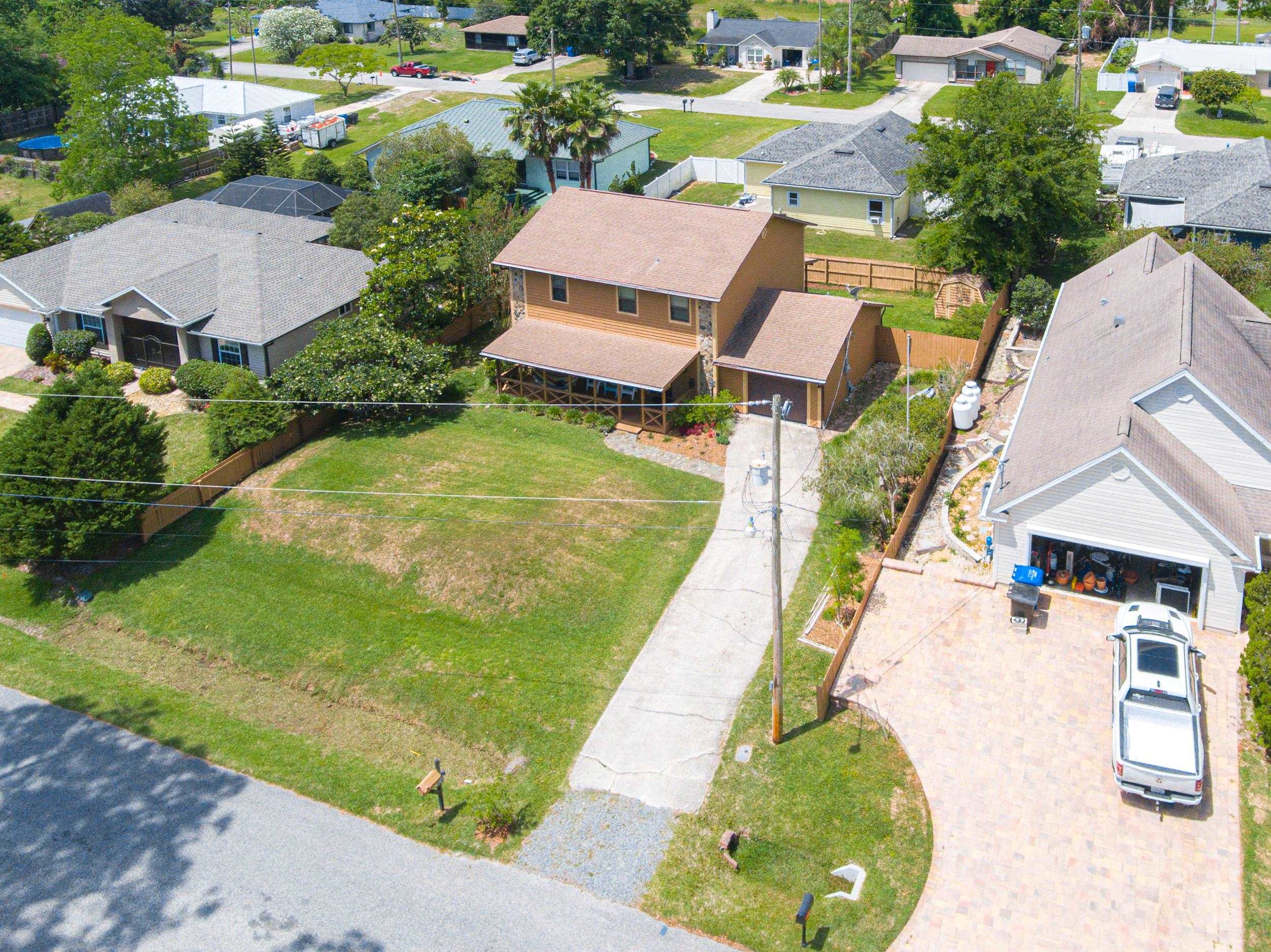 110 Harvard Road St. Augustine, FL 32086 - Photo 11 of 42 an aerial view of residential houses with outdoor space and swimming pool