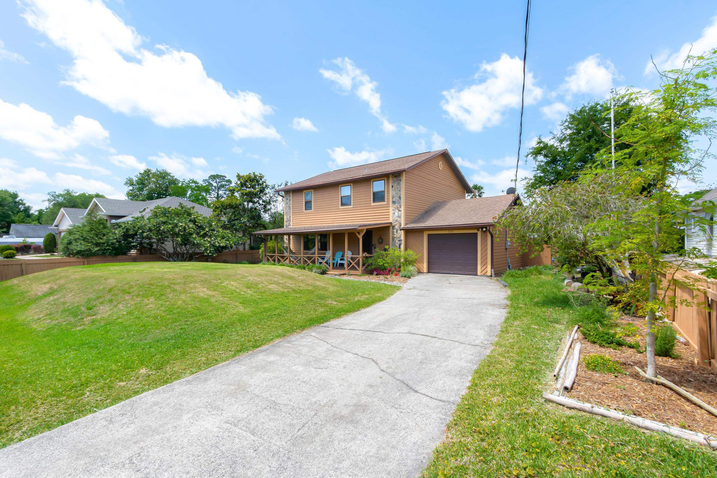 110 Harvard Road St. Augustine, FL 32086 - Photo 15 of 42 a front view of a house with garden