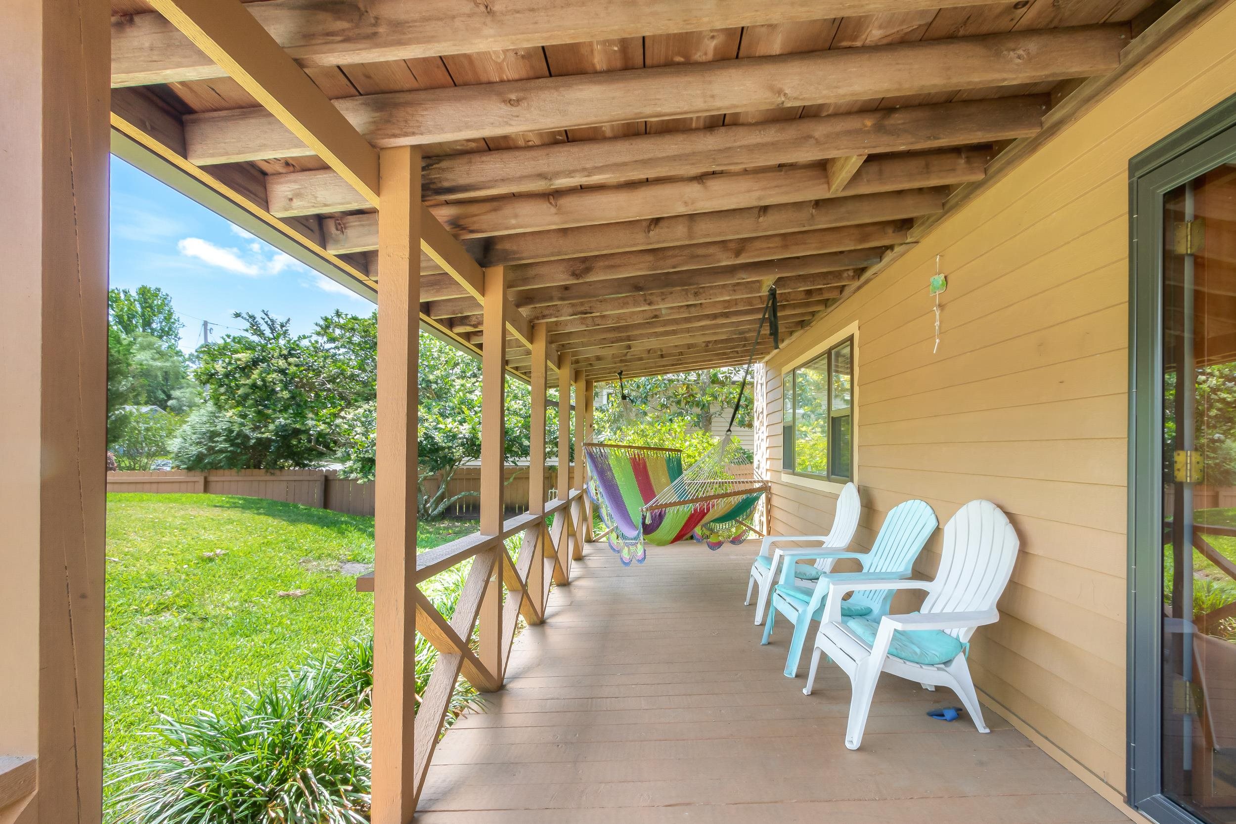 110 Harvard Road St. Augustine, FL 32086 - Photo 17 of 42 a view of a porch with chairs and backyard