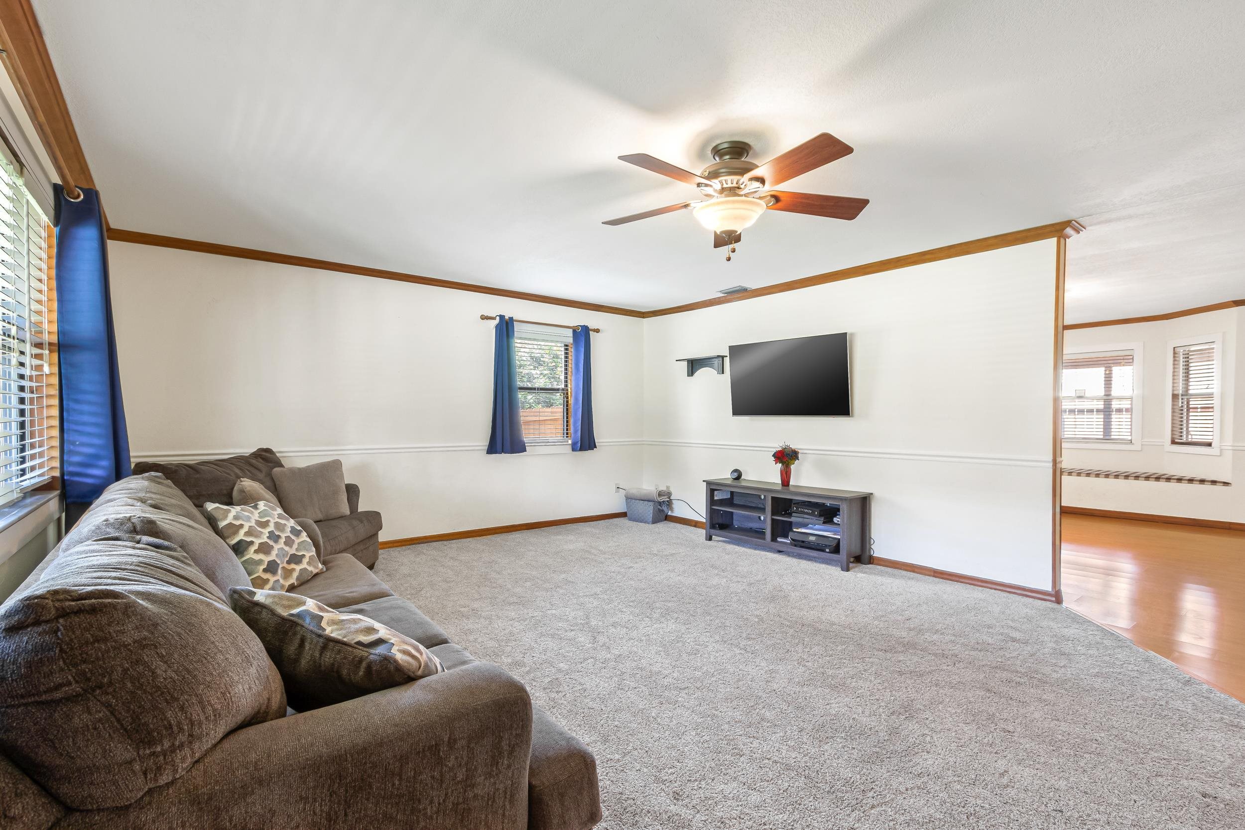 110 Harvard Road St. Augustine, FL 32086 - Photo 32 of 42 a living room with furniture and a flat screen tv