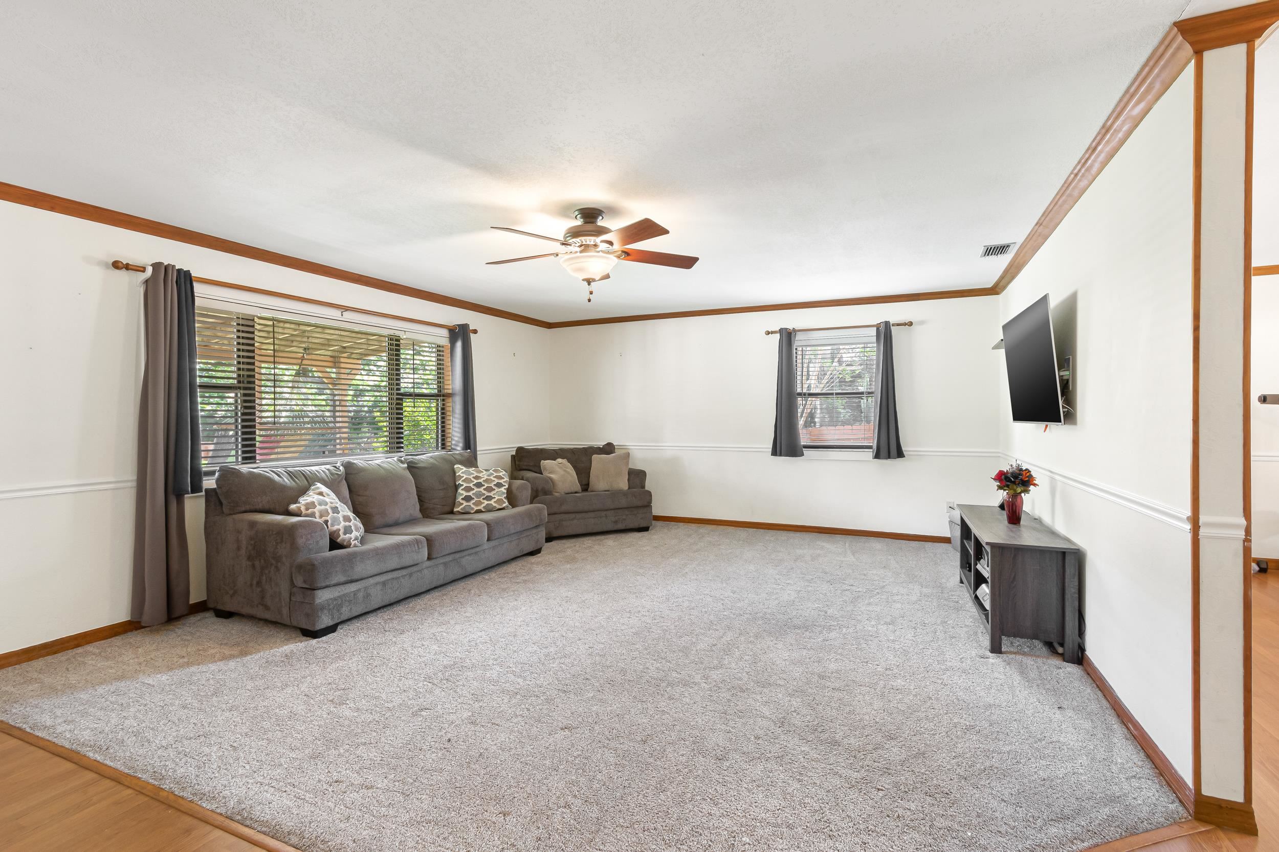 110 Harvard Road St. Augustine, FL 32086 - Photo 37 of 42 a living room with furniture and a flat screen tv