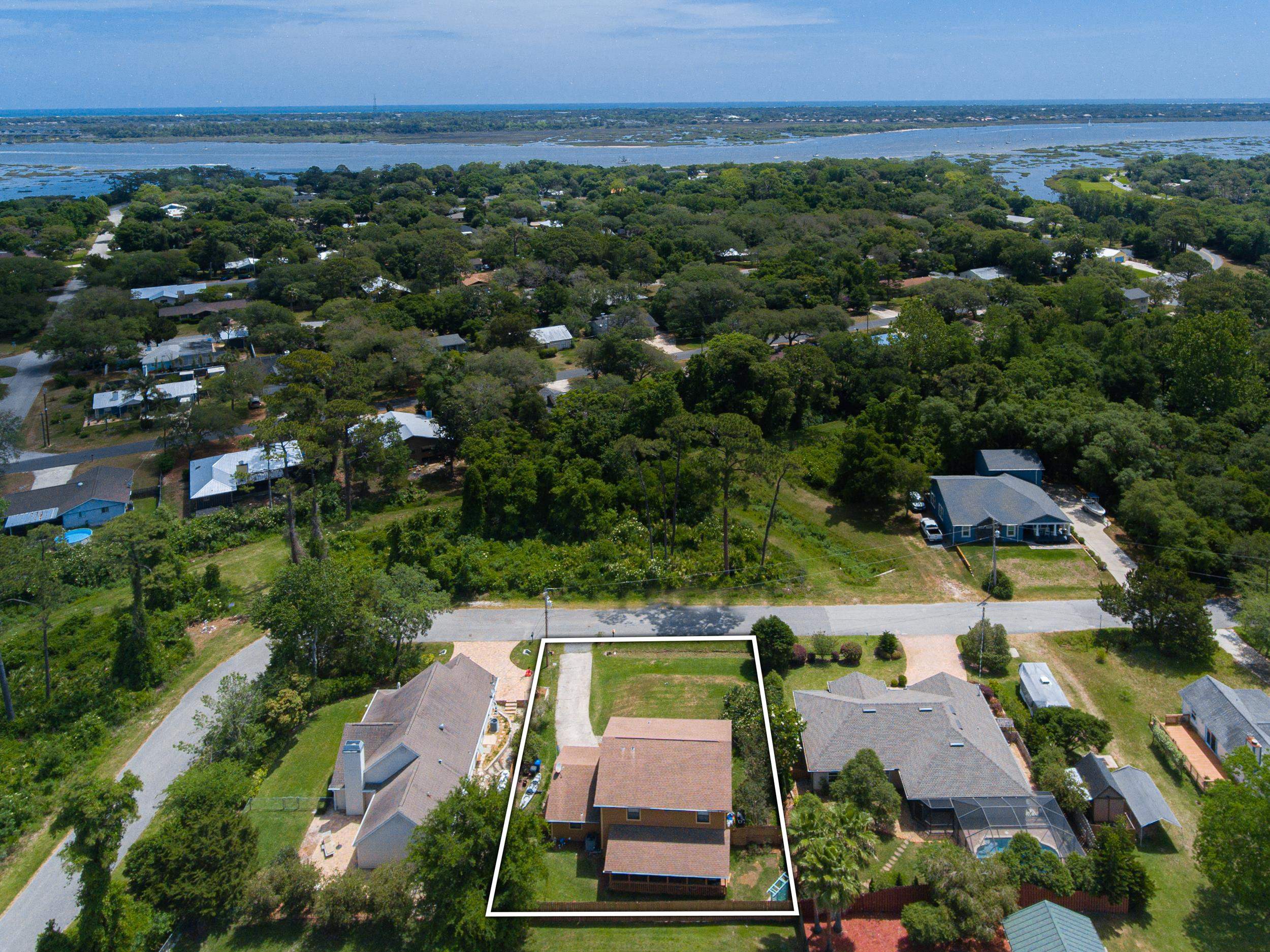 110 Harvard Road St. Augustine, FL 32086 - Photo 4 of 42 an aerial view of a house with a garden